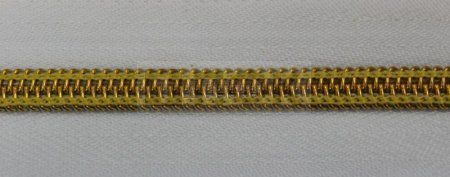 Рулонная молния спиральная (витая) тип 5 декоративная цв 101 зв золото (рул 200м/уп 2000м)